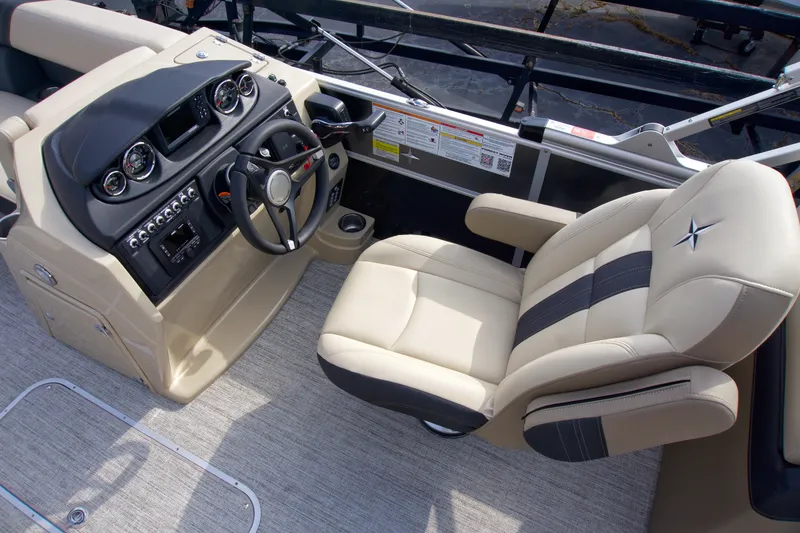 Slide: The Image of 2025 Berkshire 24RFXCTS275 boat interior with steering console and captain's chair. - 5