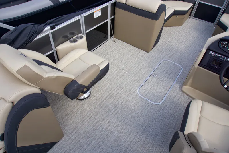 Slide: The Image of 2025 Berkshire 24RFXCTS275 pontoon boat interior with beige seating and modern design. - 6