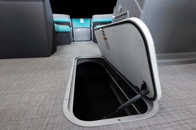 Slide: The Image of 2025 Berkshire 24RFXCTS275 boat interior with open storage compartment. - 8