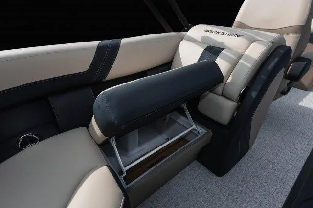 Slide: The Image of 2025 Berkshire 24RFXCTS275 boat interior with beige and black seating. - 9