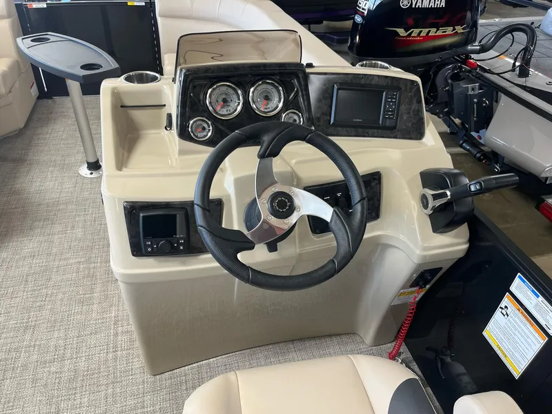 Slide: The Image of 2024 G3 SunCatcher X320 Cruise boat dashboard with steering wheel and control panel. - 10