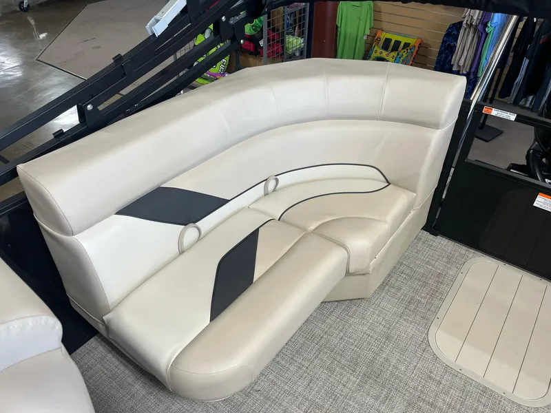 Slide: The Image of 2024 G3 SunCatcher X320 Cruise boat interior seating, beige upholstery with black accents. - 11