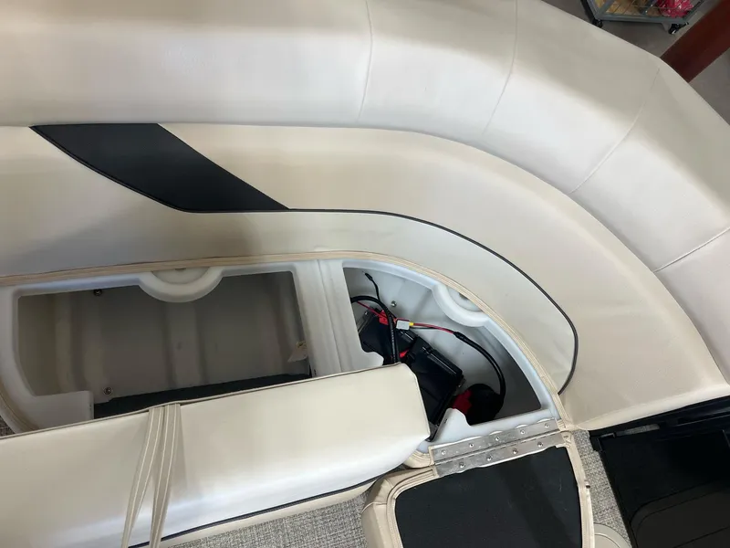 Slide: The Image of 2024 G3 SunCatcher X320 Cruise interior seating with storage compartment. - 13