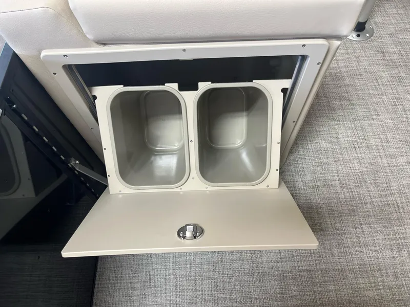 Slide: The Image of 2024 G3 SunCatcher X320 Cruise storage compartment with dual bins and latch. - 15