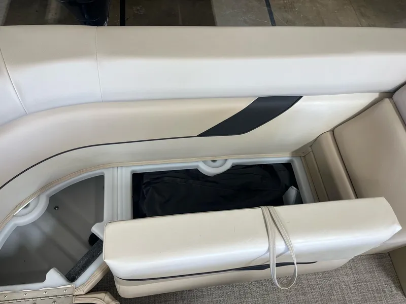 Slide: The Image of 2024 G3 SunCatcher X320 Cruise boat seat with storage compartment open. - 17
