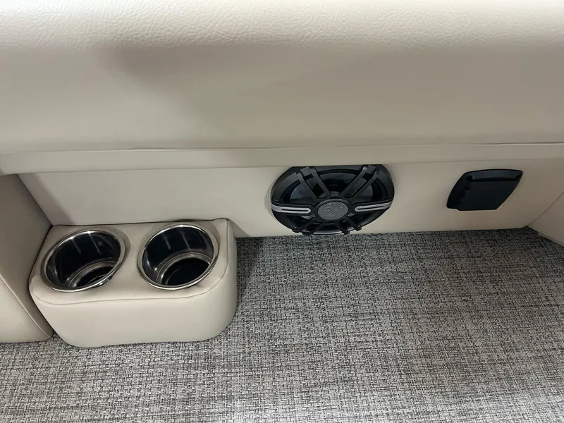 Slide: The Image of 2024 G3 SunCatcher X320 Cruise interior with cup holders and speaker. - 19