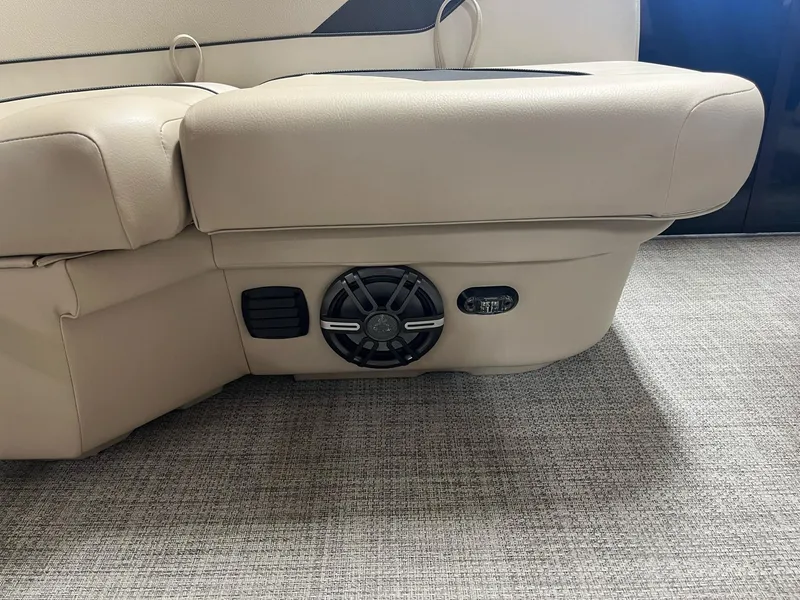 Slide: The Image of 2024 G3 SunCatcher X320 Cruise boat interior with beige seating and built-in speaker. - 21