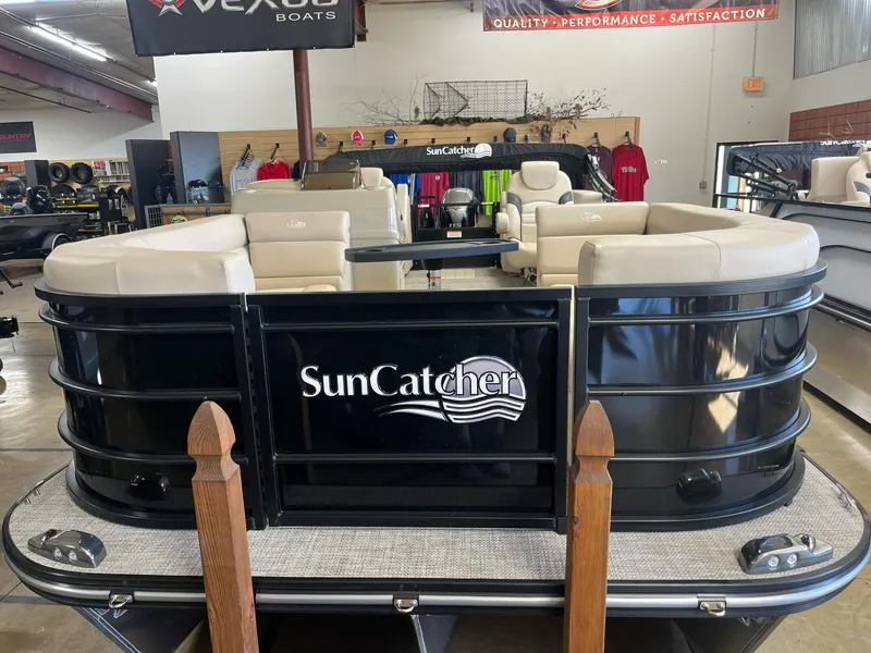 Slide: The Image of 2024 G3 SunCatcher X320 Cruise pontoon boat in showroom, featuring beige seating. - 3