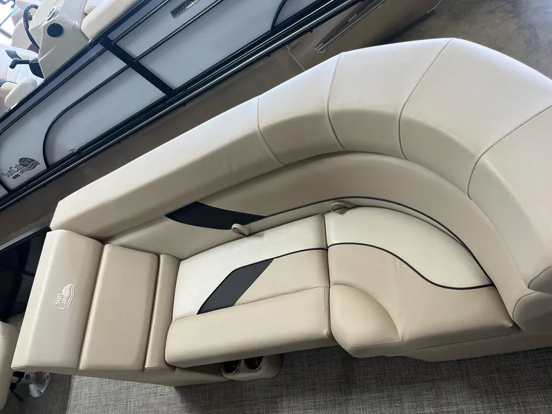 Slide: The Image of 2024 G3 SunCatcher X320 Cruise boat interior with beige seating. - 7