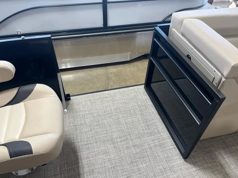 Slide: The Image of 2024 G3 SunCatcher X320 Cruise interior with beige seating and open door. - 9