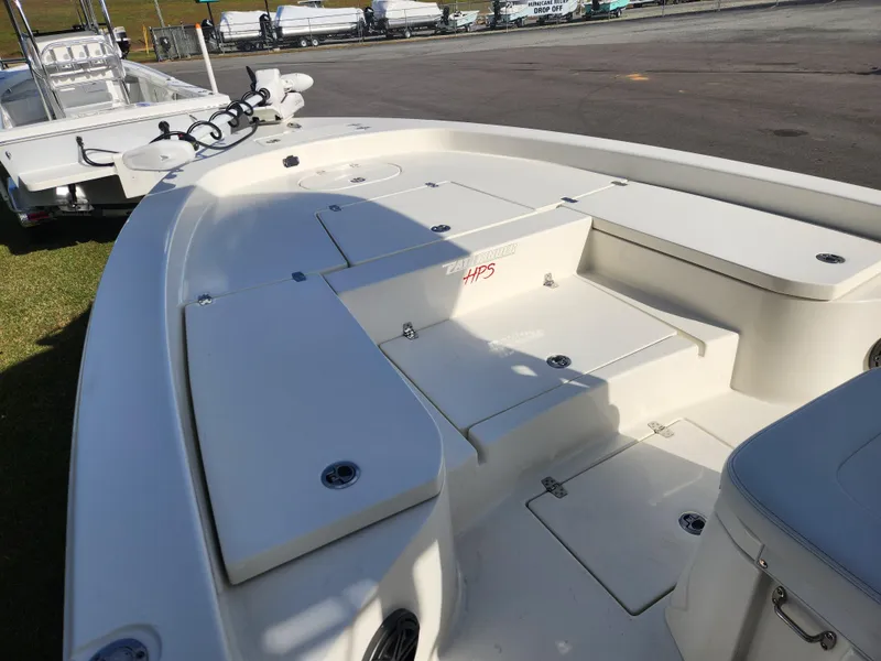 Slide: The Image of 2025 Pathfinder 2600 HPS boat deck with storage compartments and seating. - 10