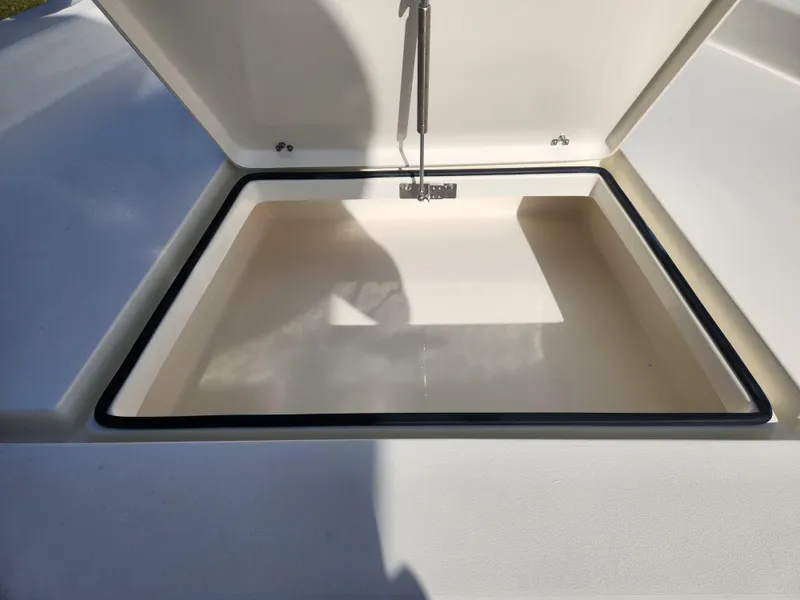 Slide: The Image of Open storage compartment on 2025 Pathfinder 2600 HPS boat. - 13