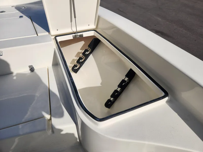 Slide: The Image of Open storage compartment on 2025 Pathfinder 2600 HPS boat. - 14