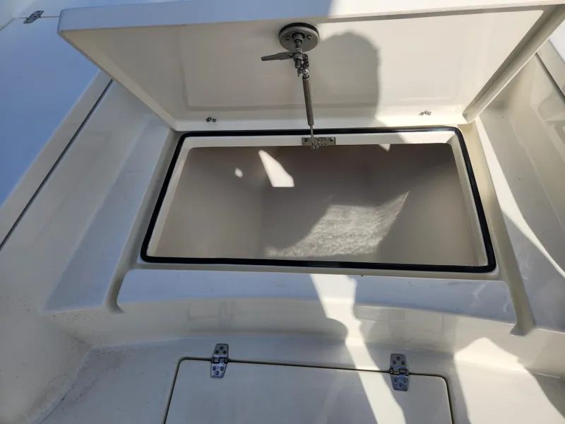 Slide: The Image of Open storage compartment on 2025 Pathfinder 2600 HPS boat. - 16