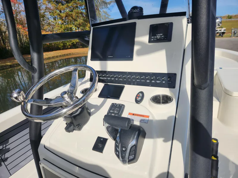 Slide: The Image of 2025 Pathfinder 2600 HPS boat console with steering wheel and control panel. - 20