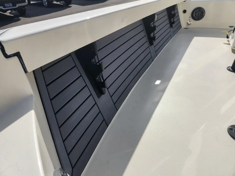 Slide: The Image of 2025 Pathfinder 2600 HPS boat interior with sleek black paneling. - 24
