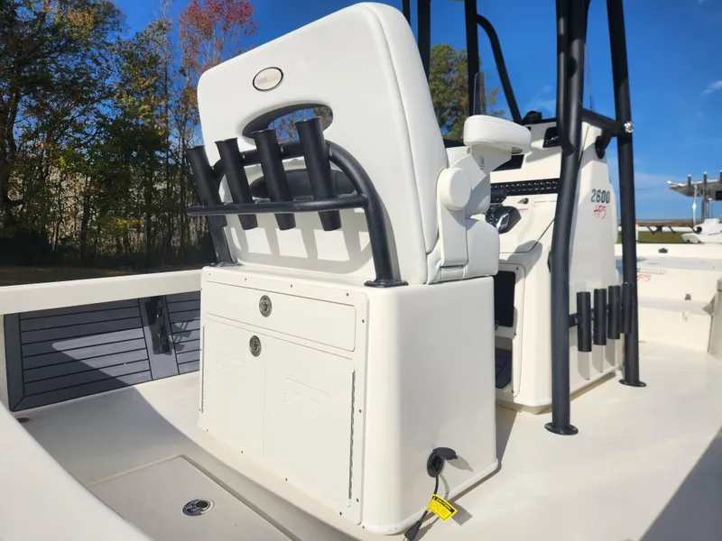 Slide: The Image of Pathfinder 2600 HPS 2025 boat interior with seating and console, outdoors. - 26