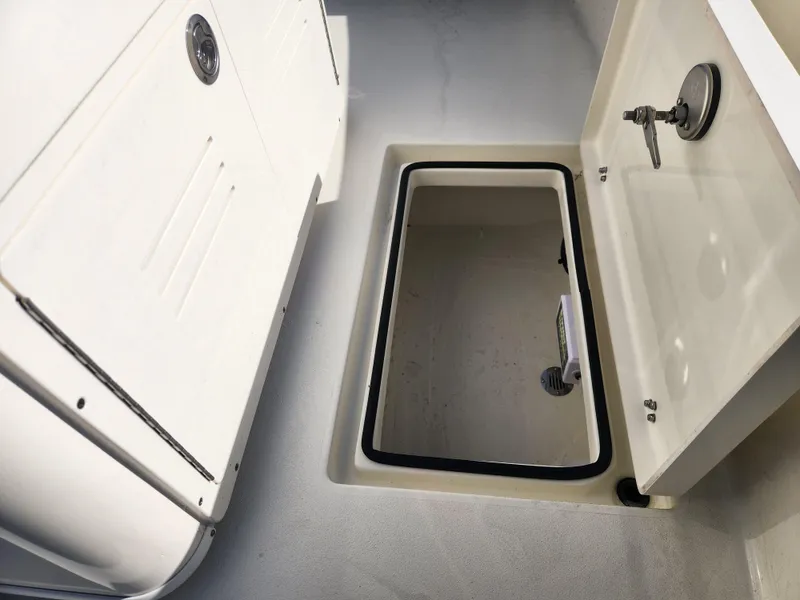 Slide: The Image of Pathfinder 2600 HPS 2025 boat storage compartment with open hatch. - 29