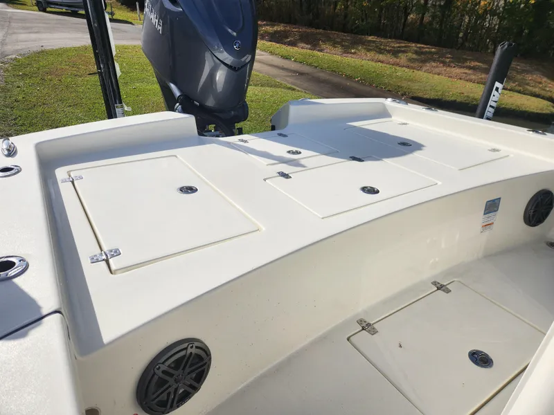 Slide: The Image of 2025 Pathfinder 2600 HPS boat deck with storage compartments and motor. - 30