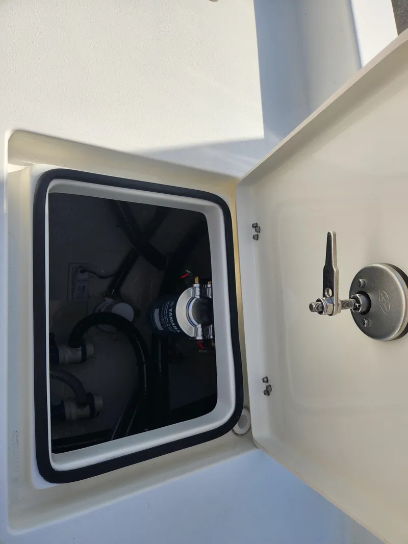 Slide: The Image of Open hatch on 2025 Pathfinder 2600 HPS boat showing internal components. - 34