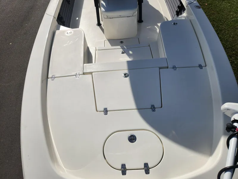 Slide: The Image of 2025 Pathfinder 2600 HPS boat deck with storage compartments and seating. - 9