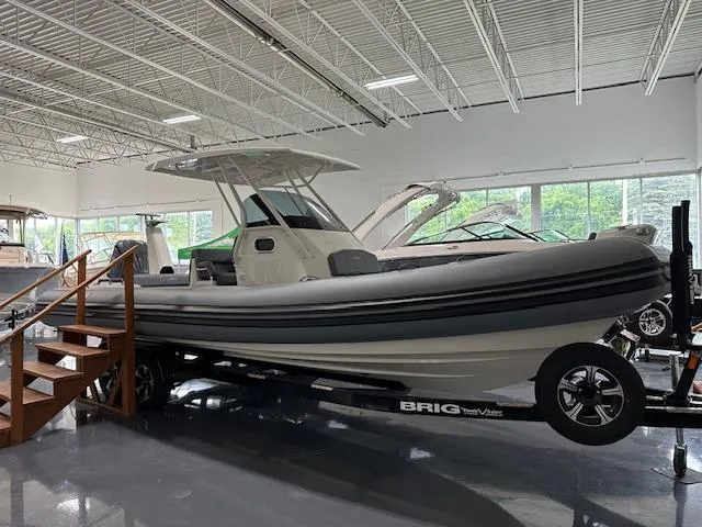 The Image of 2025 Brig Eagle 8 boat displayed indoors on a trailer. - 0