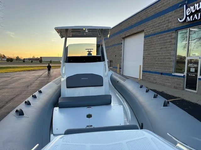 Slide: The Image of 2025 Brig Eagle 8 inflatable boat docked near a building at sunset. - 10