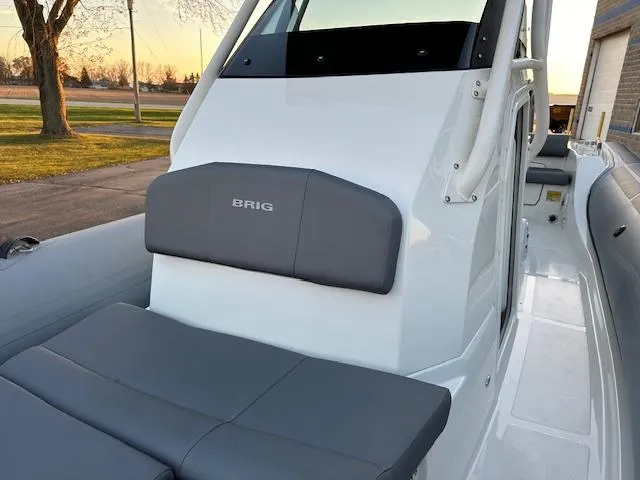 Slide: The Image of 2025 Brig Eagle 8 boat interior with gray seating and sleek design. - 25
