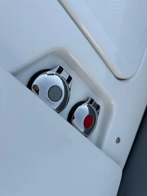 Slide: The Image of Close-up of 2025 Brig Eagle 8 boat controls, featuring sleek chrome design. - 27