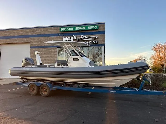 Slide: The Image of 2025 Brig Eagle 8 boat on trailer outside marine service shop. - 5