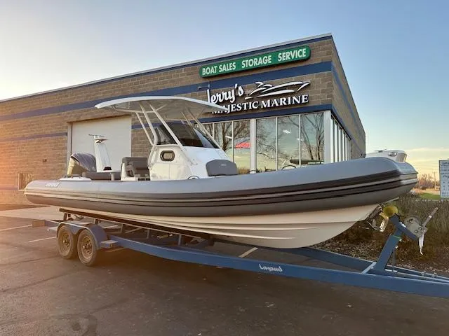 Slide: The Image of 2025 Brig Eagle 8 boat on trailer outside marine dealership. - 6