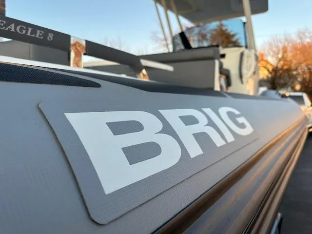 Slide: The Image of 2025 Brig Eagle 8 boat close-up with logo and sleek design. - 9