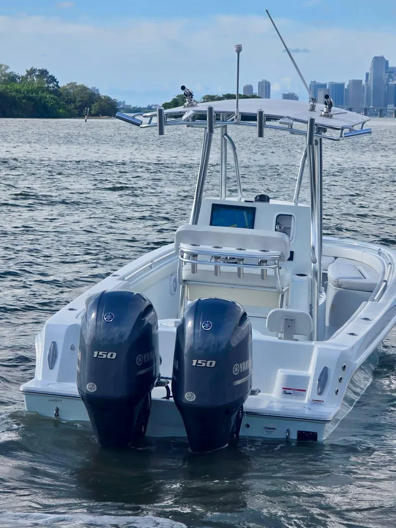 Slide: The Image of 2023 Contender Center Console boat with dual Yamaha engines on the water. - 7