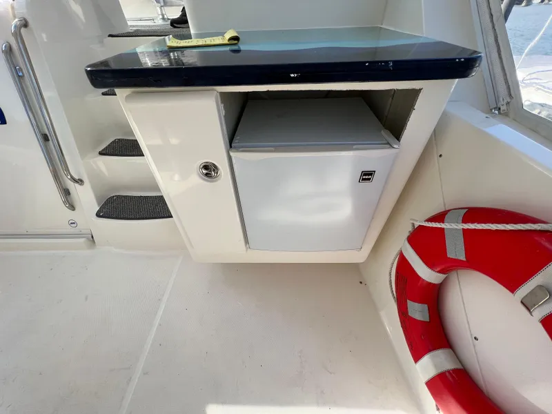 Slide: The Image of 2004 Silverton 39 Motor Yacht interior with mini fridge and life preserver. - 12