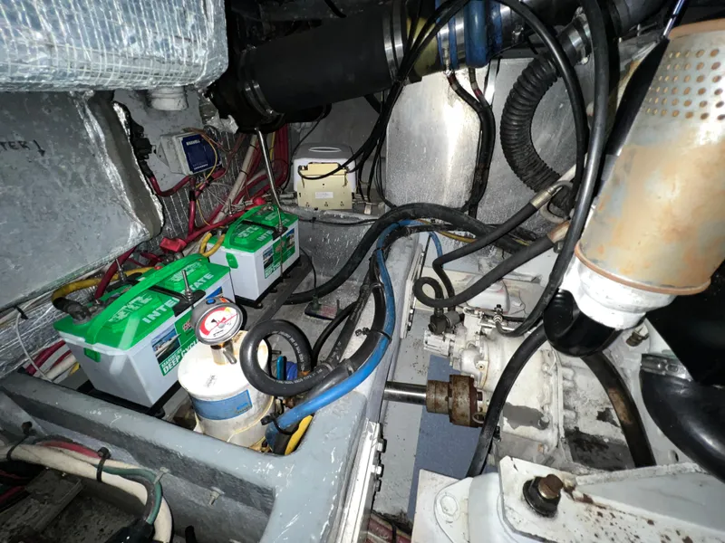 Slide: The Image of Engine room of 2004 Silverton 39 Motor Yacht with batteries and wiring. - 32
