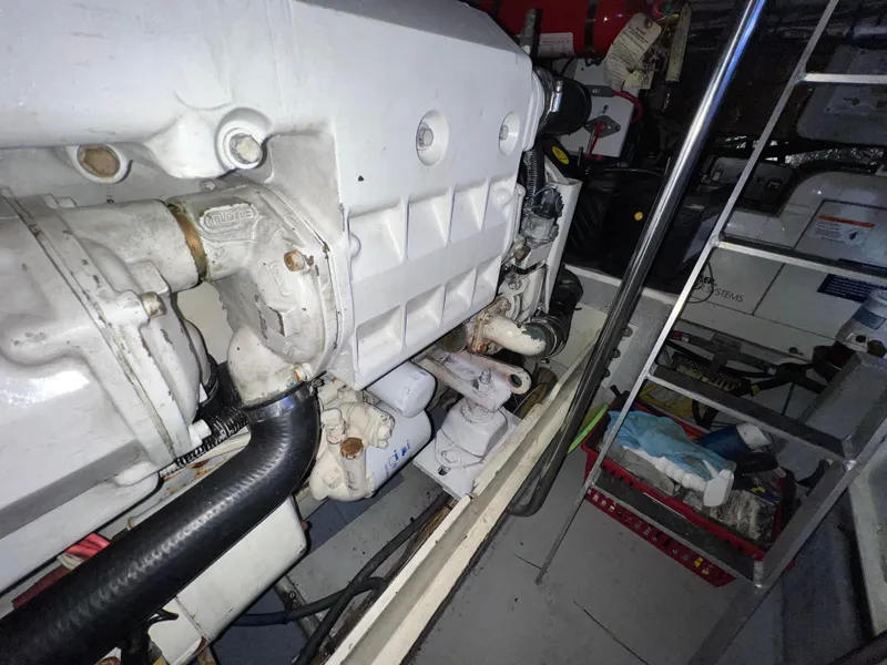 Slide: The Image of Engine room of 2004 Silverton 39 Motor Yacht, showcasing mechanical components and equipment. - 34