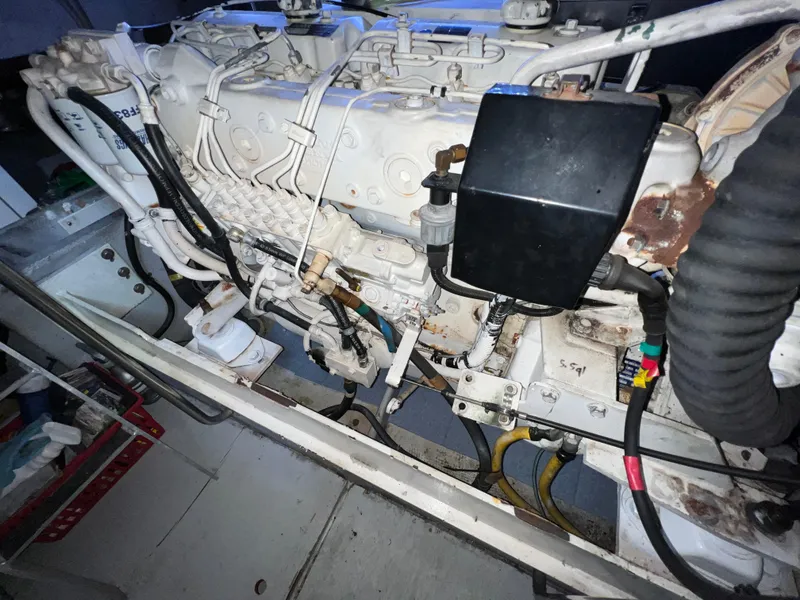 Slide: The Image of Engine compartment of a 2004 Silverton 39 Motor Yacht, showcasing mechanical components. - 36