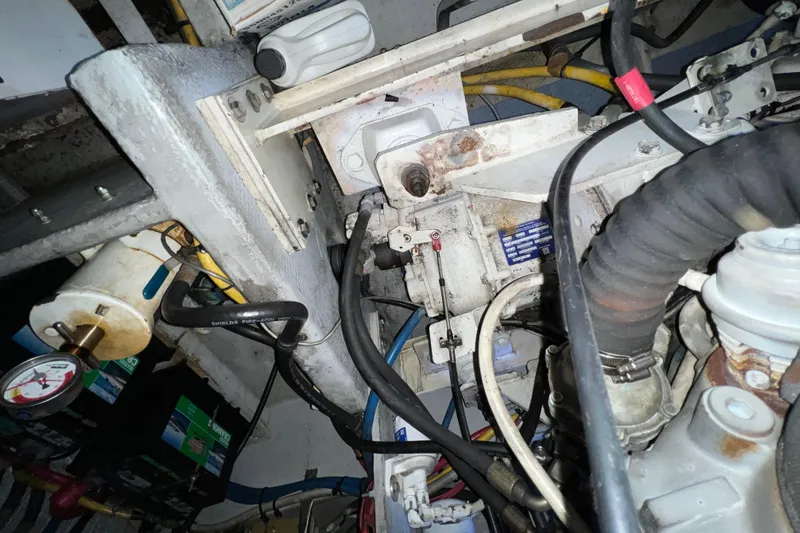 Slide: The Image of Engine compartment of a 2004 Silverton 39 Motor Yacht with visible wiring and components. - 40