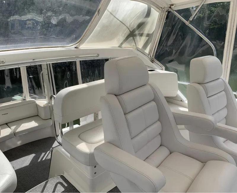 Slide: The Image of Interior of 2004 Silverton 39 Motor Yacht with plush white seating. - 5