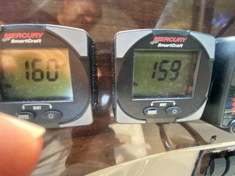 Slide: The Image of Mercury SmartCraft displays on 2015 Bayliner 335 Cruiser showing readings of 160 and 159. - 15