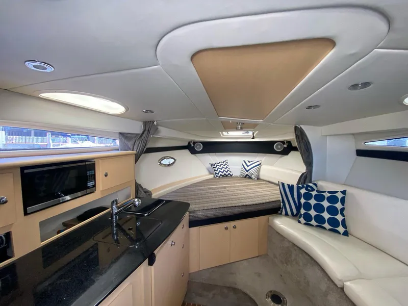 Slide: The Image of Luxurious interior of 2015 Bayliner 335 Cruiser with modern kitchen and cozy seating. - 6