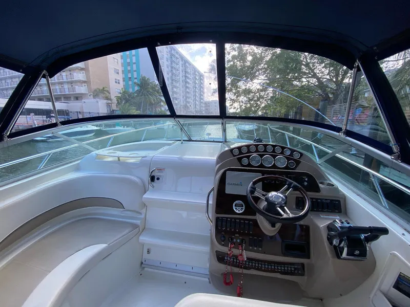 Slide: The Image of Interior view of 2015 Bayliner 335 Cruiser cockpit with steering wheel and dashboard. - 8