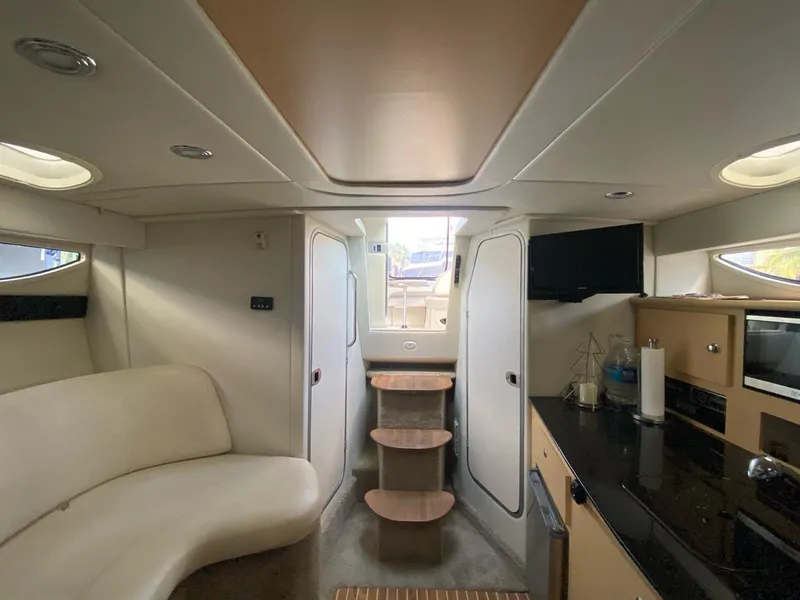 Slide: The Image of Luxurious interior of 2015 Bayliner 335 Cruiser with modern amenities and elegant design. - 9
