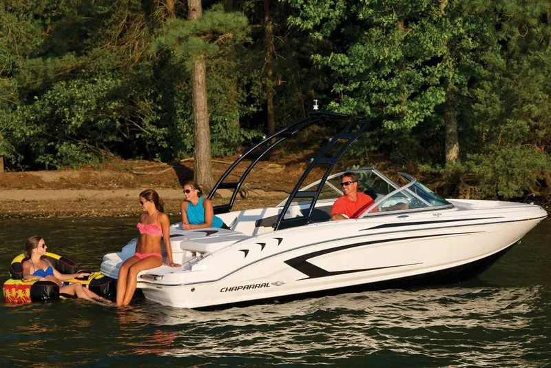 Slide: The Image of 2016 Chaparral 19 H2O Sport boat with people enjoying a sunny day on the water. - 20