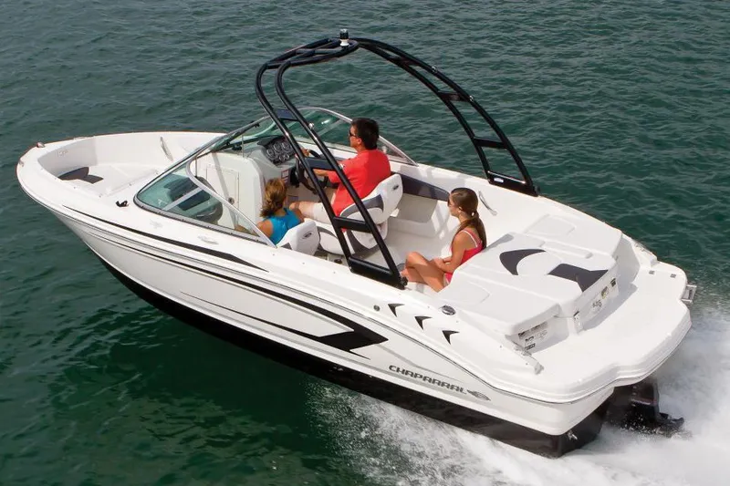 Slide: The Image of 2016 Chaparral 19 H2O Sport boat cruising on water with passengers. - 21