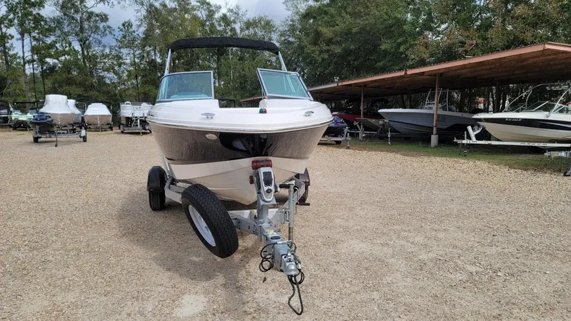 Slide: The Image of 2016 Chaparral 19 H2O Sport boat on trailer in outdoor storage area. - 7
