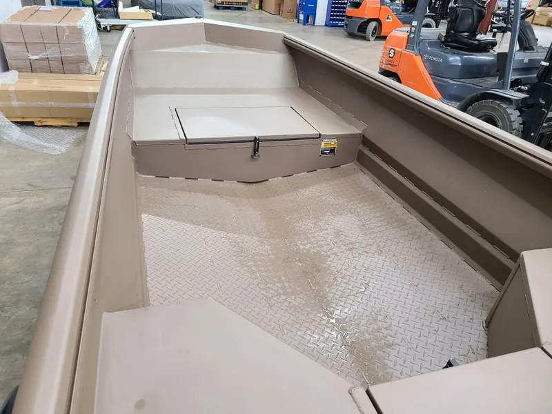 Slide: The Image of 2024 Reaper Boats 550 interior view in a warehouse setting. - 7