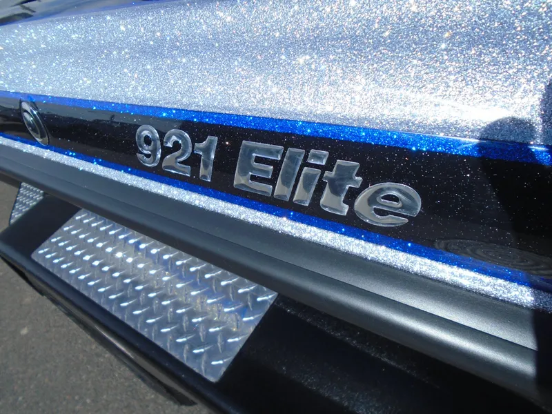Slide: The Image of Close-up of 2005 Phoenix 921 Elite model name on metallic surface. - 14