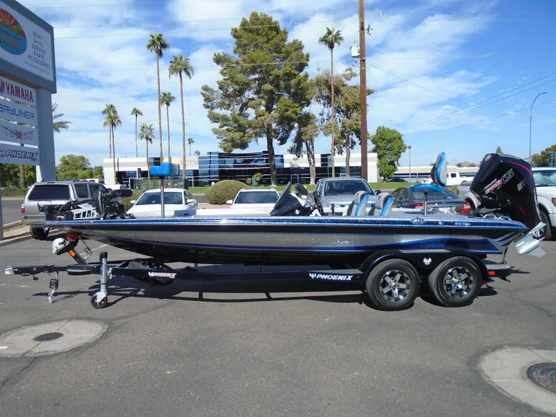 Slide: The Image of 2005 Phoenix 921 ELITE boat on trailer in parking lot, sunny day. - 15