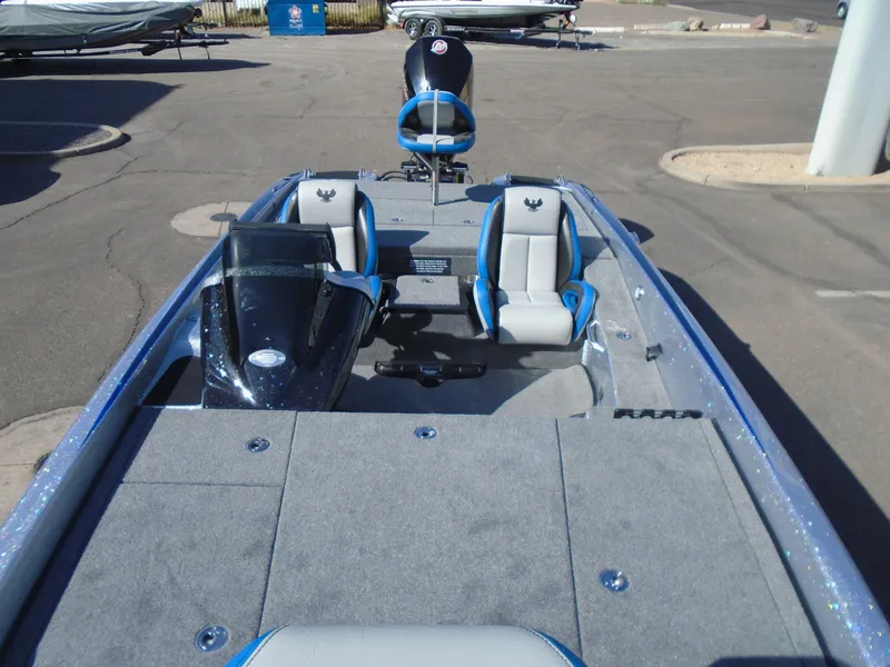 Slide: The Image of 2005 Phoenix 921 ELITE boat interior with gray and blue seating. - 7